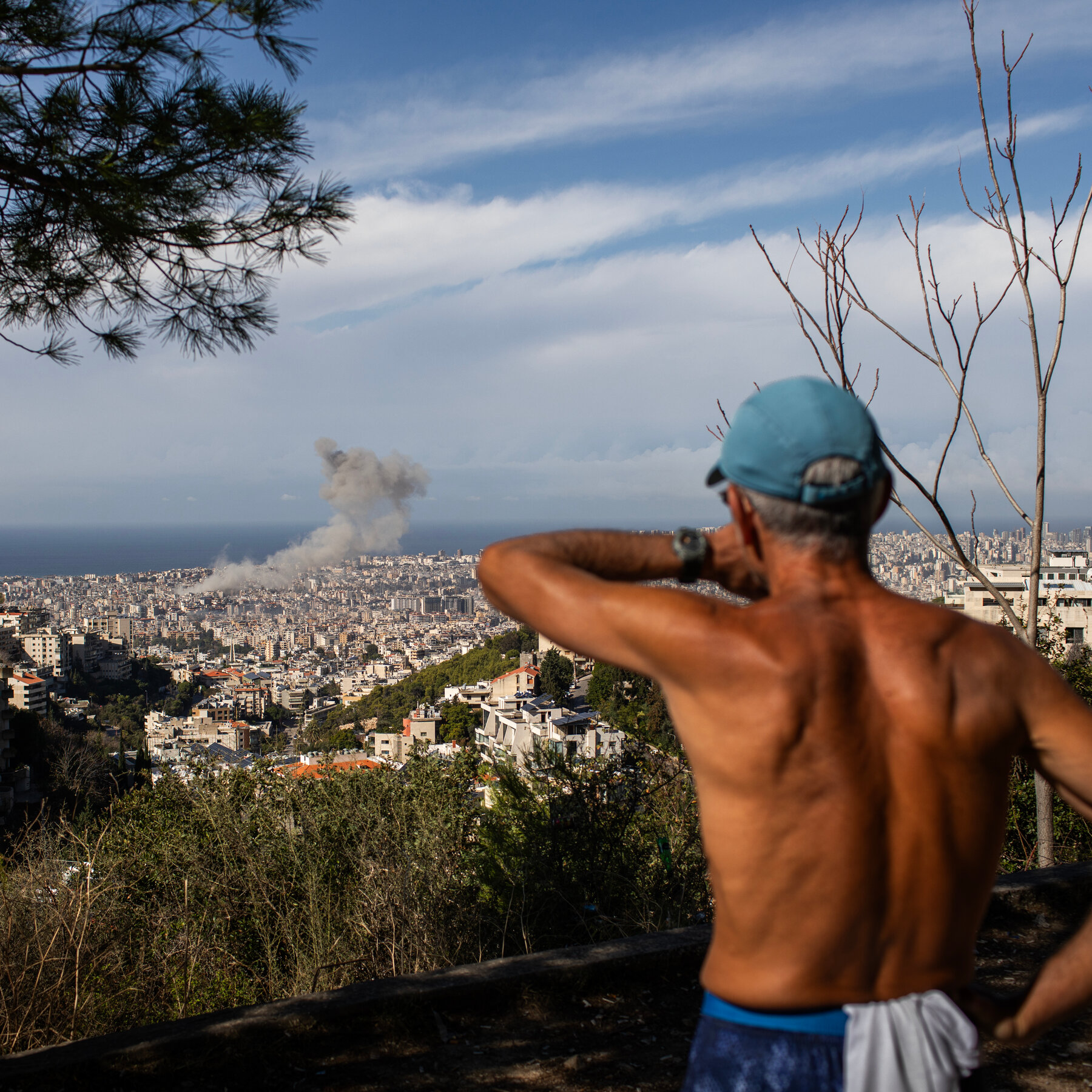 Crowds Watch Israeli Airstrikes from a Beirut Hillside